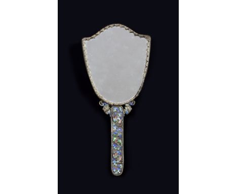 A Chinese hand mirror 19th Century set within a silver and Canton enamel frame decorated cranes flying amidst clouds and inla