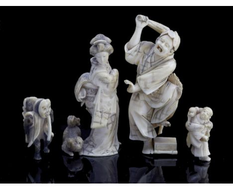 A Japanese ivory okimono of a frightened gentleman raising a club Meiji period (1868-1912) a hossu falling onto a box, probab