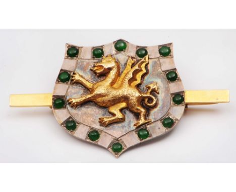 A Chinese jade mounted gold brooch/pendant circa 1900  central winged dragon and spinach jade mounts