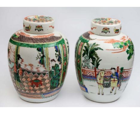 A pair of Chinese famille verte ginger jars and covers 1900-1920 decorated with an interior house and garden scene with figur