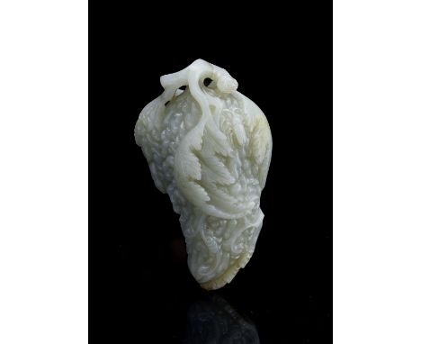 A Chinese white jade carving 18th/19th Century in the form of a bitter melon on the branch, 12.5cm high