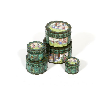 A graduated set of Chinese enamel polychrome boxes late 19th Century the covers decorated with gaming and other figures, larg
