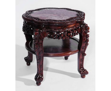 A Chinese rosewood shaped top large fish tank stand 19th Century with foliate carved border, shelf below and carved supports,