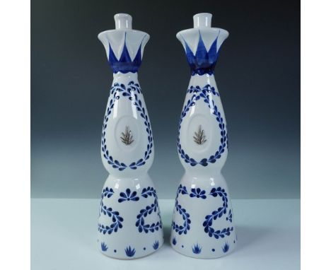 Pair of empty ceramic tequila bottles from Clase Azul Reposado, a premium tequila brand known for its artisanal presentation.