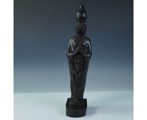A contemporary black stone sculpture made in Egypt, depicting the god Osiris in a traditional mummiform pose with the double 