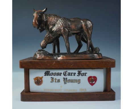 A McCormick Straight Bourbon Whiskey commemorative decanter from the Moose Collector Series, featuring a finely detailed figu