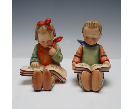 Pair of Goebel Hummel porcelain bookend figurines featuring the beloved Bookworm Boy and Bookworm Girl designs. Each hand-pai