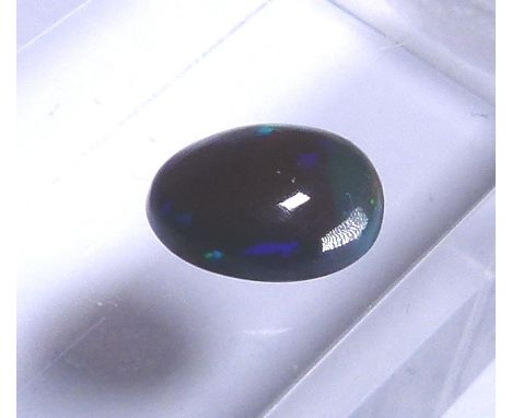 Natural black opal, approximately 1.6 ct, 9.83 x 7.76 x 4.51 mm