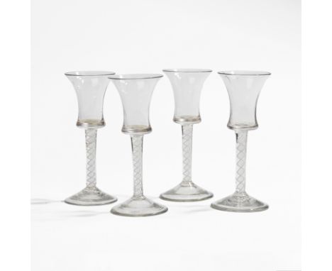 Quatre verres à jambe en verre spiralé. XVIIIe siècleH. 15.5 cmA set of four opaque twist wine glasses, circa 1765With waiste