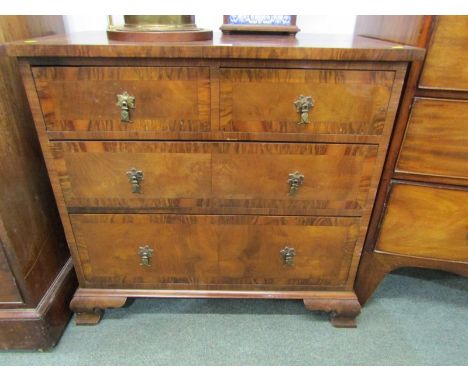 EARLY GEORGIAN DESIGN CROSS BANDED WALNUT SMALL CHEST, 2 short, 2 long graduated drawers with ogee bracket feet and brass axe