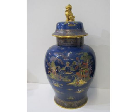 CARLTON, large powder blue ground "Willow Pattern" lidded jar with gilded temple dog finial, 58cm height 