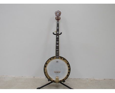 A Fender five string G banjo with gold coloured hardware and closed back, Korean made, serial KD04100026