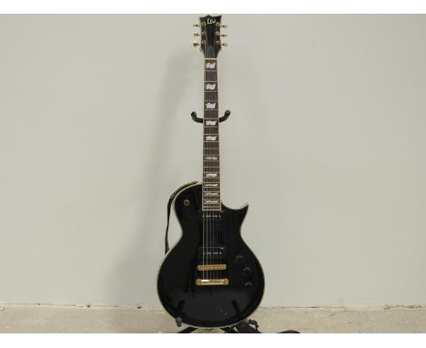 An ESP Ltd EC-256 Les Paul style electric guitar with black body and gold coloured hardware, made in Vietnam, serial I110 506