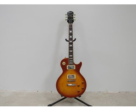 A Gibson Epiphone Les Paul electric guitar with sunburst body, no pickguard, Limited Edition,  serial number L6120170, soft c