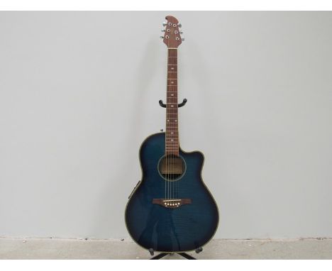 A Tanglewood Odyssey electro-acoustic guitar with blue burst body, model TMO-7W, soft case