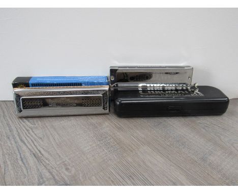 An M Suzuki Chromatix Chromatic harmonica, cased, together with a Bergzauber tremolo harmonica, boxed (2) 