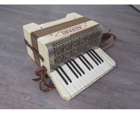 An Alvari 12 bass piano accordion, pearlescent case