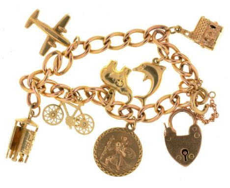 A 9CT GOLD CHARM BRACELET WITH SEVEN GOLD CHARMS, IN 9CT GOLD, MARKED 9CT OR UNMARKED, 27.5G++LIGHT WEAR CONSISTENT WITH AGE 