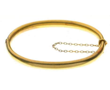 A GOLD BANGLE, MARKED 15CT, 7.5G++LIGHT WEAR CONSISTENT WITH AGE 