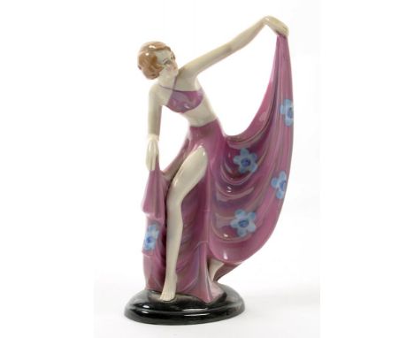 A CONTINENTAL ART DECO PORCELAIN FIGURE OF A BIKINI DANCER ON OVAL BLACK GLAZED BASE, 22CM H, C1930
