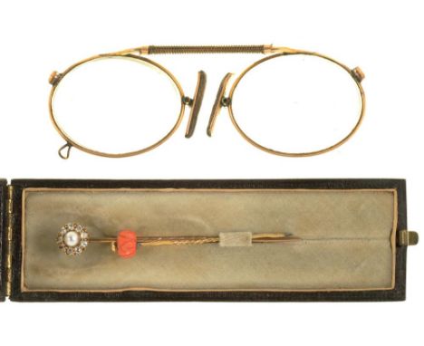 A DIAMOND AND PEARL STICK PIN IN GOLD, UNMARKED, A CARVED CORAL BEAD STICK PIN, AND A PAIR OF GOLD RIMMED PINCE-NEZ++LIGHT WE