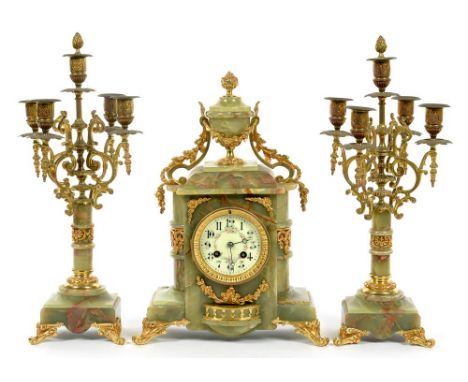 A 19TH C GILTMETAL MOUNTED ONYX GARNITURE DE CHEMINEE, THE ARCHITECTURAL CASED CLOCK WITH FRENCH BELL STRIKING MOVEMENT FLANK