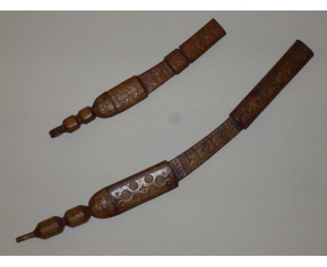 TWO WEST AFRICAN KNIVES BOTH WITH LEATHER HANDLE AND SCABBARD, ENGRAVED DESIGN TO BLADES AND ORNATE BLIND STAMP DESIGN TO THE