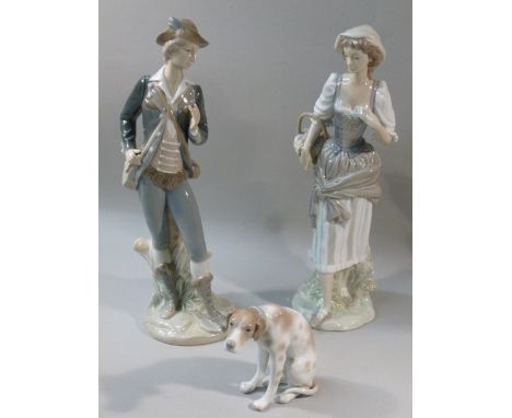 THREE LLADRO FIGURES COMPRISING A YOUNG MAN WITH SHOULDER BAG AND FLASK (H: 29.5 cm), A YOUNG WOMAN CARRYING A BASKET OF FRUI