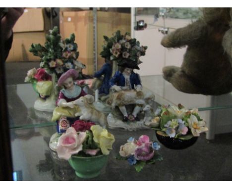 A pair of 18th Century Chelsea ceramic figures, lady and gent with sheep, both a/f, together with three ceramic posies (5)   