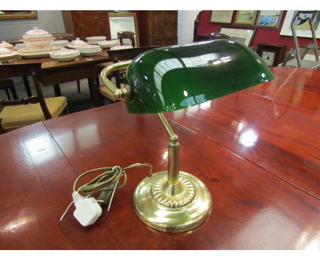 A modern banker's desk lamp, brass base with green shade
