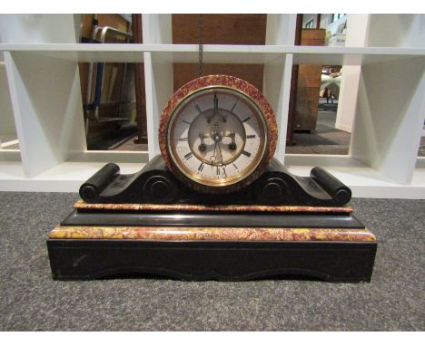 A late Victorian black slate and rouge marble mantel clock, with black Roman numerals to the white enamelled chapter ring cen