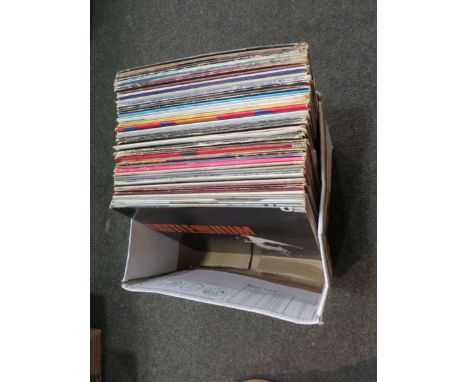 A box of approx. 50 mixed LP's including U2, Madonna, Pink Floyd, Depeche Mode, Jeff Beck, The Beatles, Paul McCartney, The R