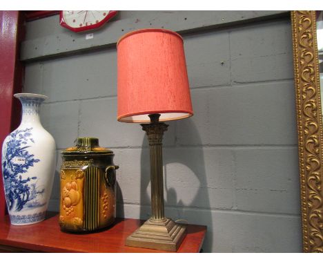 A brass Corinthian column form table lamp base with shade