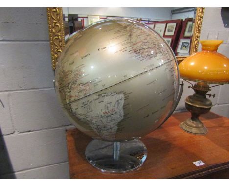 A 20th century globe on chrome stand in a pale gold metallic finish