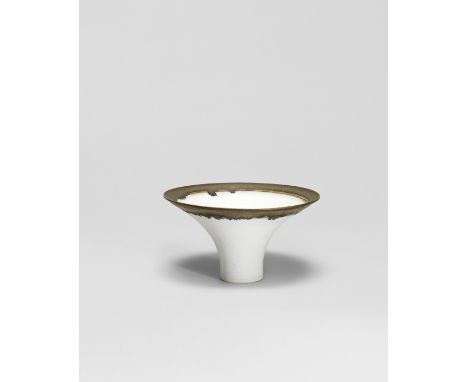 Lucie RieFlared bowl, circa 1970Porcelain, matt white glaze with golden manganese lip.9.4 cm high, 16.8 cm diameter Impressed