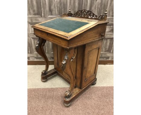 VICTORIAN WALNUT DAVENPORT WRITING DESK, the back with fretted gallery, slope top writing surface supported by cabriole uprig