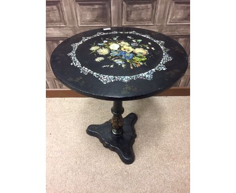 VICTORIAN PAPIER-MACHE TABLE the scalloped oval top inlaid with mother of pearl and floral spray, over baluster column and tr