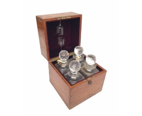 LATE VICTORIAN OAK CASED DECANTER SETwith four cut glass decanters and stoppers, two damaged, contained within a four divisio