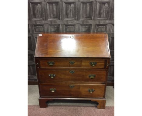 EARLY 19TH CENTURY MAHOGANY BUREAUthe sloping fall front opening to reveal a fitted interior on three graduated long drawers 
