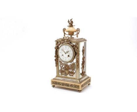 A 19th Century French ormolu and four-glass eight day mantel clock, the enamelled arabic dial, two train drum movement with c