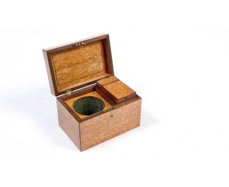 An early 19th Century maple tea caddy, of plain rectangular form with bone escutcheon, the interior fitted with mixing bowl w