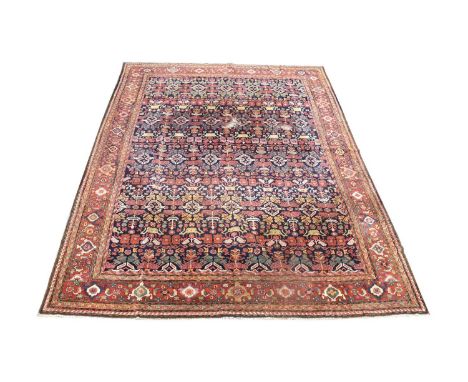 A Tetex carpet, with stylized floral motifs, 393 x 286cms.