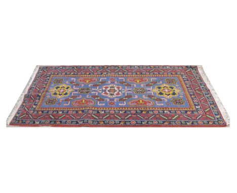 Caucasian Shirwan rug, the geometric floral decoration on light blue ground, 174 x 96cms. 
