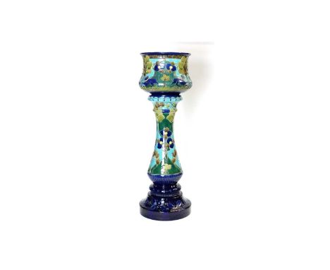 A Burmantoft's Art Nouveau 'Faience' Pottery jardiniere and stand, circa 1900, incised with dogs, trees and leaves picked out