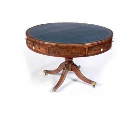 A Scottish Regency mahogany rent table, the circular moulded top inset blue tooled leather surface, the frieze with four real