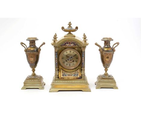 AD Mougin: a 19th Century French gilt brass and champleve three-piece clock garniture, the clock with roman dial, the case wi