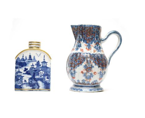 A Chinese clobbered blue and white jug, Qianlong, of ribbed ovoid form, overpainted in iron-red and gilding, 15cms; and an 18