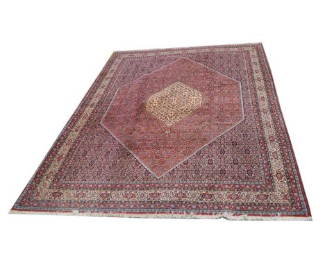 Bidjar carpet, the central medallion on floral diamond-shaped field with repeated design, 348 x 251cms.