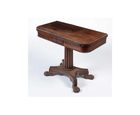 A Victorian rosewood card table stamped ‘Gillows Lancaster’, the ‘D’ shaped folding swivel top with applied gadrooned border 