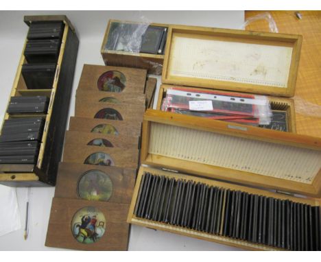 Four boxes of various magic lantern slides, including many coloured slides and a quantity of loose 